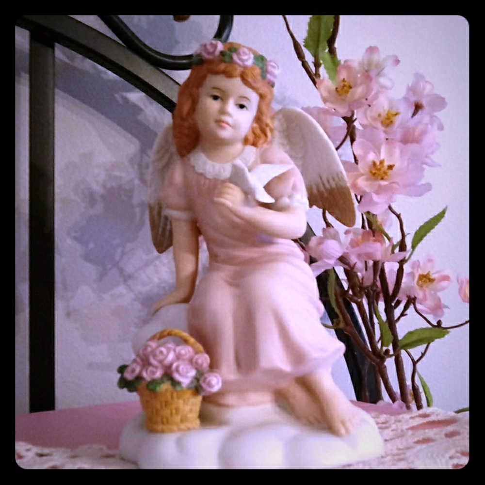 Angel  with dove figurine. 8"